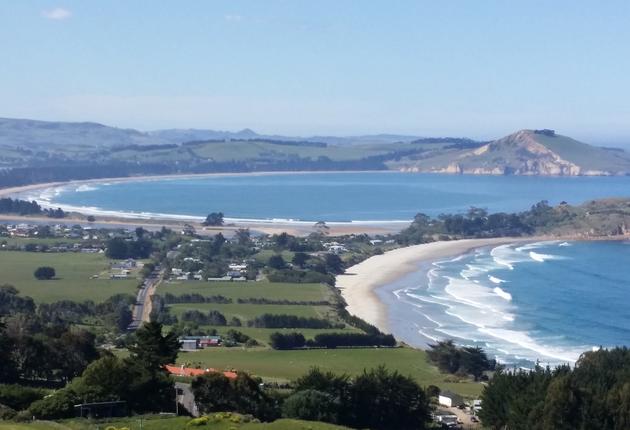 Walk, swim, surf, fish or simply relax in this picturesque village on the coast north of Dunedin.