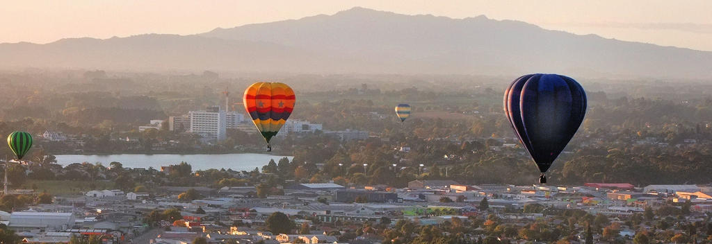 Hot air balloons ascending through the sunrise can be enjoyed each year at Balloons over Waikato