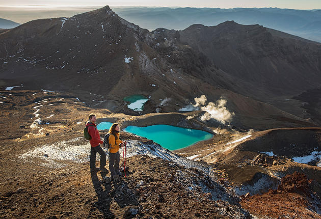 Lava flows, an active crater, steam vents, emerald-coloured lakes and magnificent views combine to make the Tongariro Alpine Crossing hike an unforgettable walking journey.